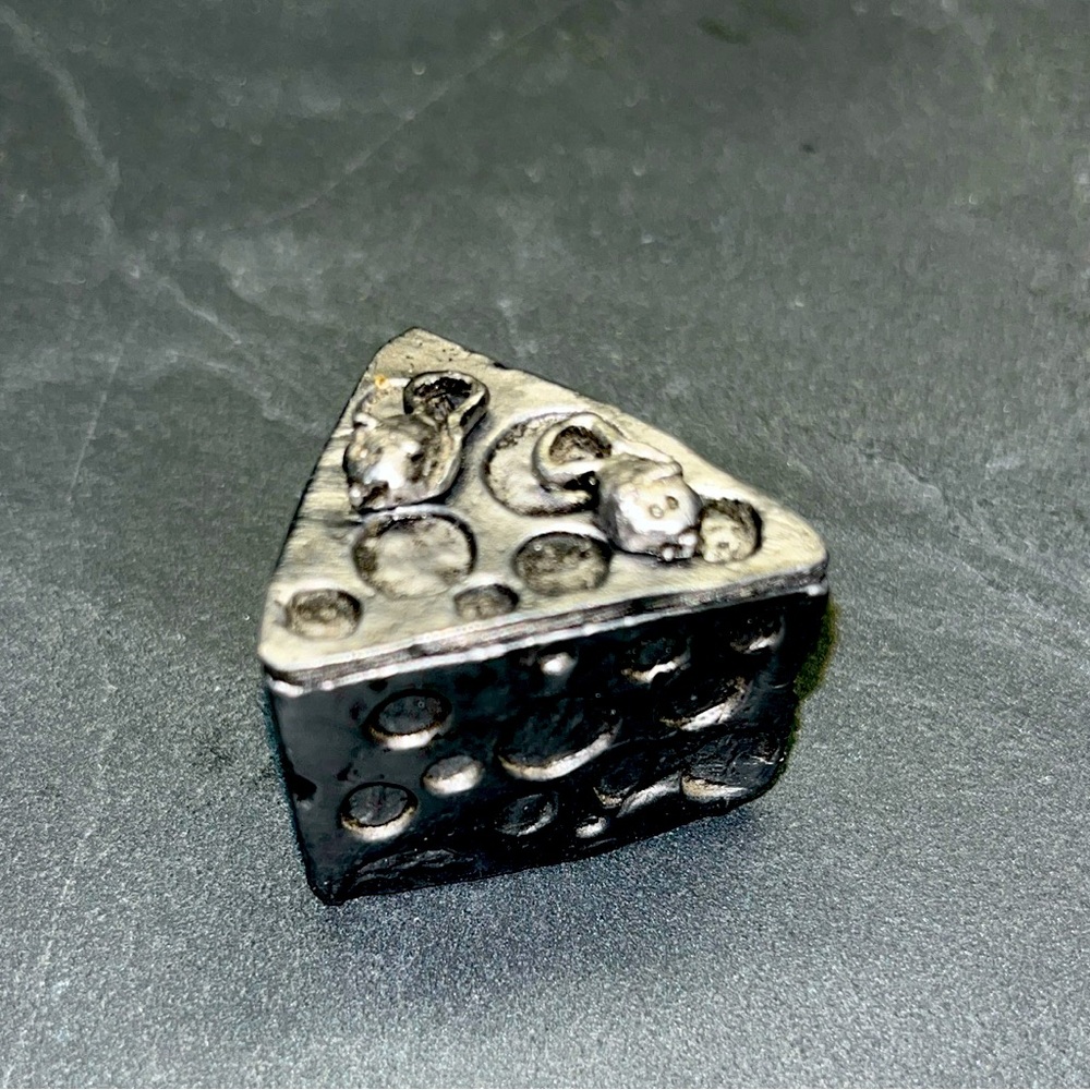 The neatest coolest mouse earrings on a block of cheese